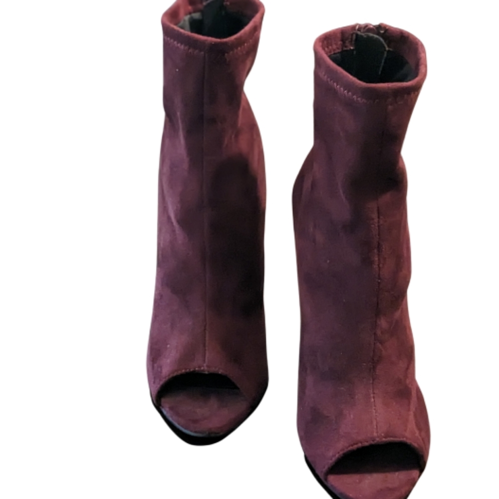 Burgundy suede ankle boots.